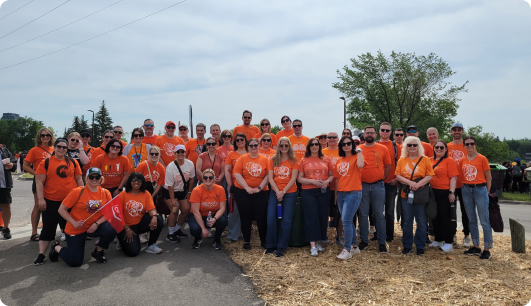 Group of people wearing Truth and Reconciliation orange shirts